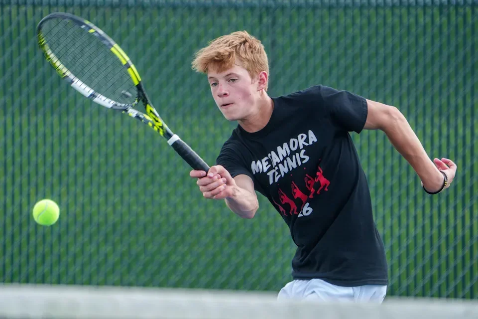 Metamora’s Hunter Poole battles Pekin’s Jacob Brown in a Mid-Illini dual tennis match Tuesday, April 14, 2026 in Metamora.